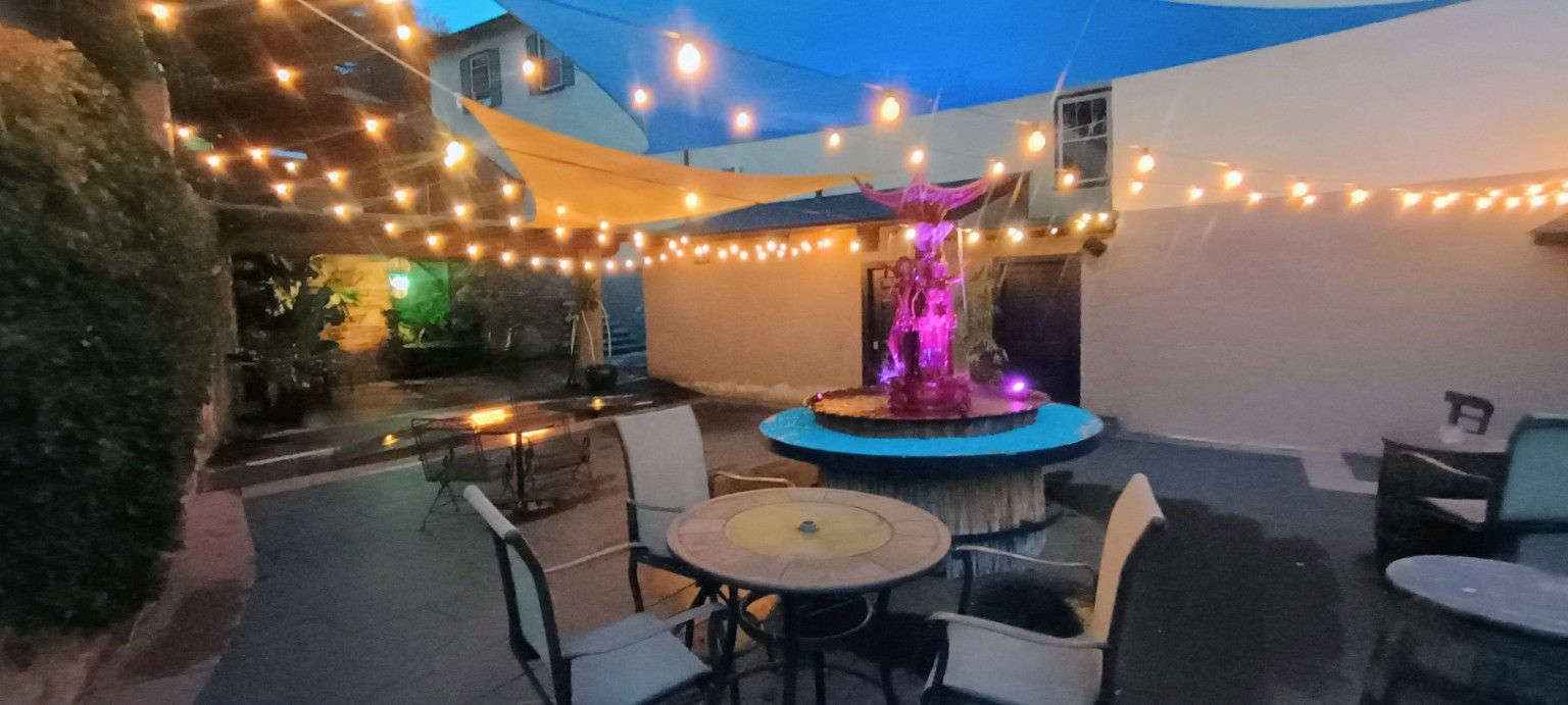 Franklintown Inn courtyard with fountain and string lights