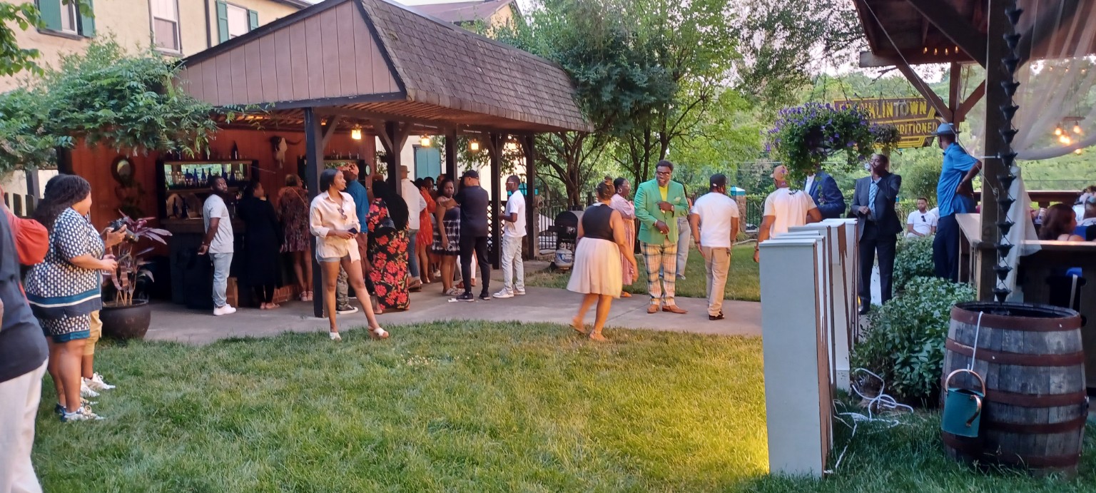 Guests enjoying an event in the garden